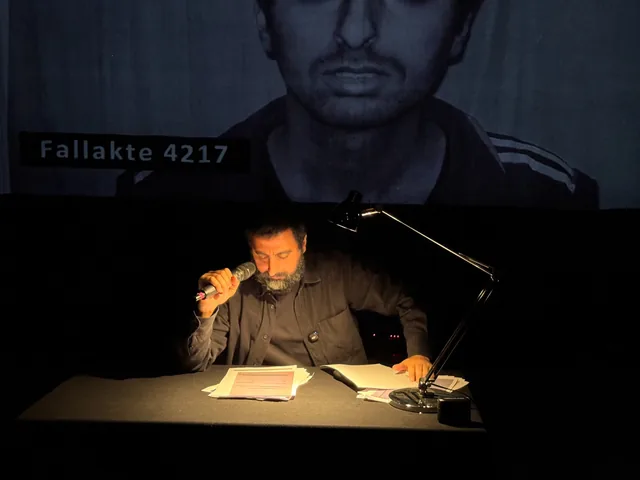 Amer Matar reading from his personal security dossier during Dossier 4217 in Hanover